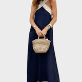 Elegantna haljina s otvorenim leđima i modernim preklopljenim okom