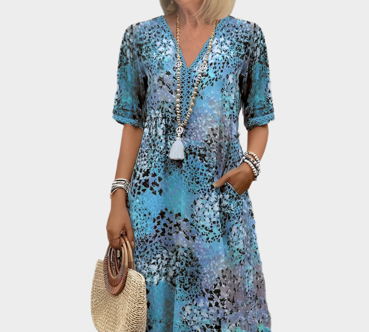 Prozračno laneno haljina s ljetnim uzorkom i V-izrezom